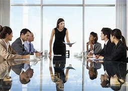 A meeting with employees discussing strategies in a conference room to improve work productivity.